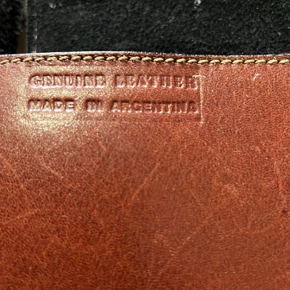 brown leather and features the gold-toned horsebit hardware.  B36 - Picture 6 of 9